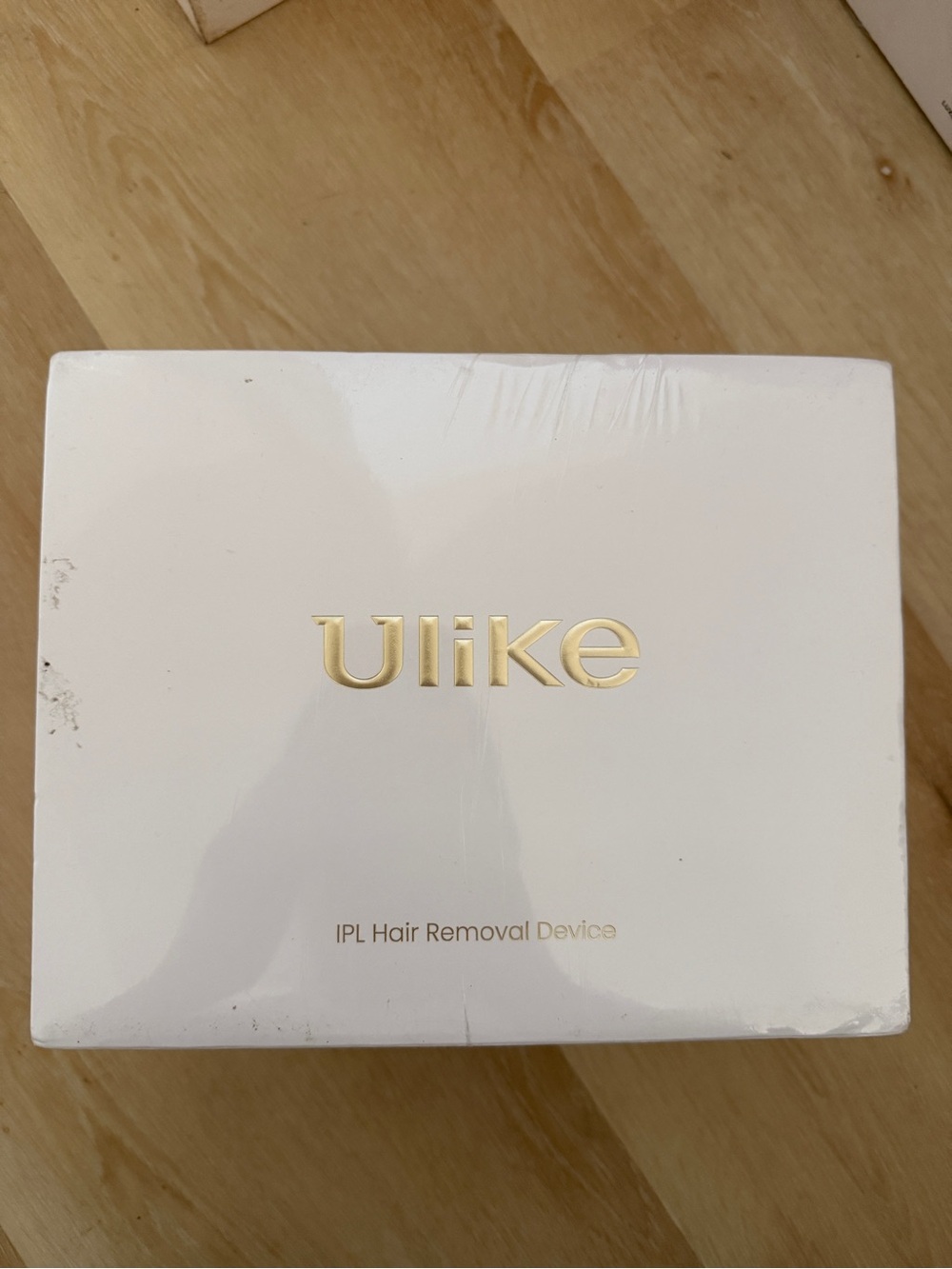 Ulike IPL Hair Removal Device - White with Gold Logo